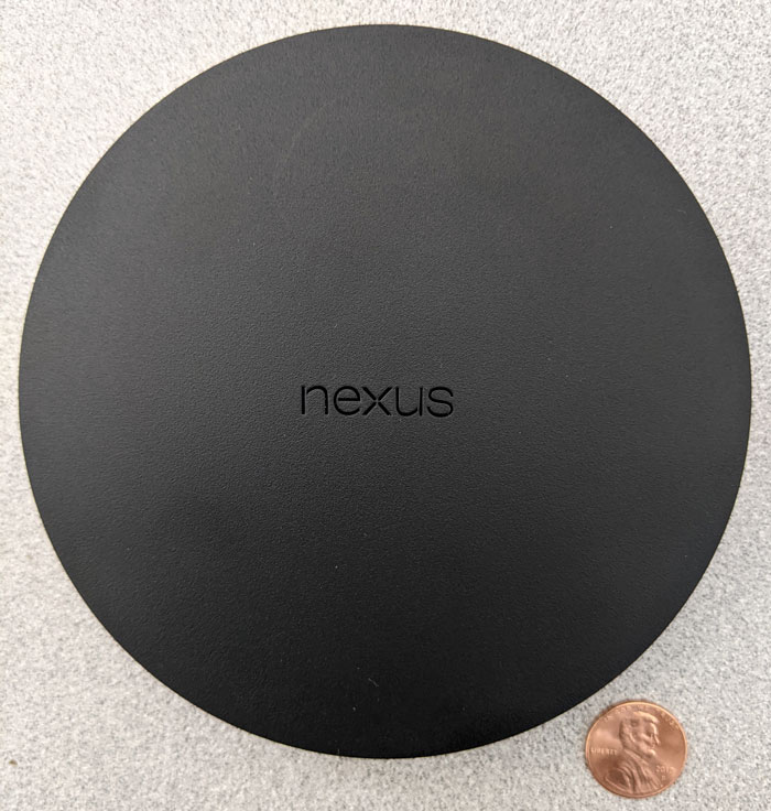 Nexus Player的照片与一便士的规模
